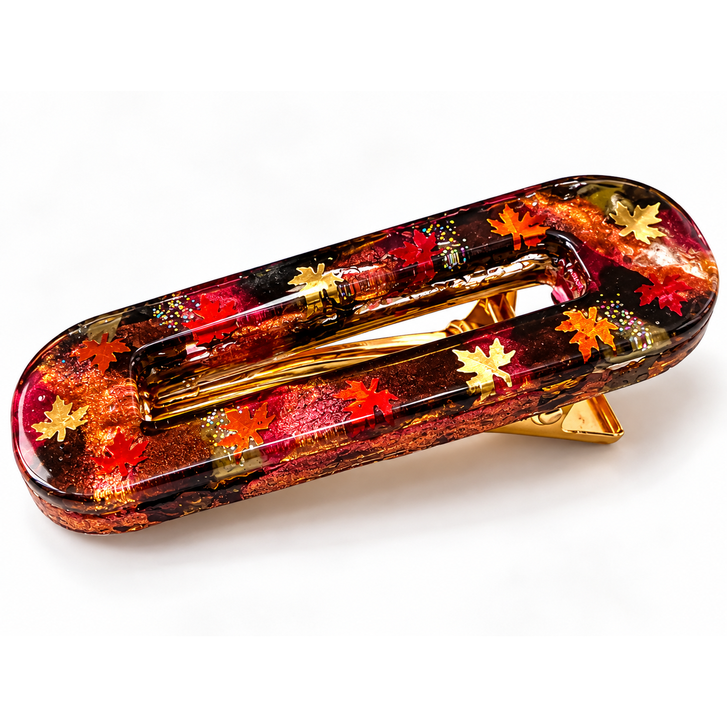 Barrette Resin’ Feuilles d’automne vue de profil : feuilles rouges et dorées prises dans la résine – Aline B Création